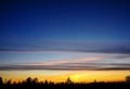 Silhoutte of tree and islands at far with vivid color of the sky during sunset