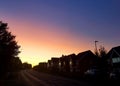 This silhoutted line of houses bask in dawns early sunlight with stunning skyline