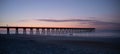 Silhoutted Ocean Pier at Sunrise Royalty Free Stock Photo