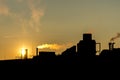 Silhuette Industrial factory smoke from smokestacks over colorful sunset sky industry Royalty Free Stock Photo