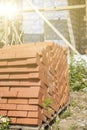 silicate bricks are stacked in pile on pallet and ready for construction