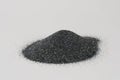 Silicon carbide powder close-up isolated on white background. Silicon carbide abrasive grit for restore stones to