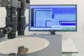 Silicon wafer on machine process examining in microscope Royalty Free Stock Photo