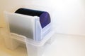 Silicon Wafers in white plastic holder box on a table- A wafer is a thin slice of semiconductor material, such as a