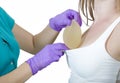 Silicone breast implant. Doctor hold silicone breast prosthesis Royalty Free Stock Photo