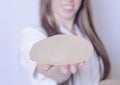 Silicone breast implants. Nurse holding implants. Doctor holding implants. Plastic surgery