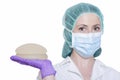 Silicone breast implants. Nurse holding implants. Doctor holding implants. Plastic surgery