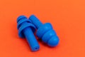 Silicone ear plugs for human ears on red background Royalty Free Stock Photo