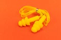 Silicone ear plugs for human ears on red background Royalty Free Stock Photo