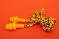 Silicone ear plugs for human ears on red background Royalty Free Stock Photo