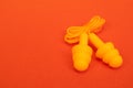 Silicone ear plugs for human ears on red background Royalty Free Stock Photo