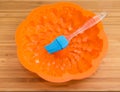 Silicone pastry brush in empty silicone cake pan Royalty Free Stock Photo