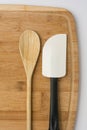 Silicone Spatula and Wooden Spoon on Wooden Cutting Board