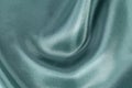 Silk background, texture of green ribbed shiny fabric