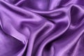 Silk background, texture of violet shiny fabric