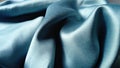 Silk of blue color. Wave Satin Glitter Fabric