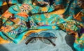 Silk clothes abstract texture and hippie sun glasses