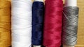 Silk and cotton threads for sewing and embroidery. Spools with multi-colored threads. Royalty Free Stock Photo