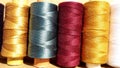 Silk and cotton threads for sewing and embroidery. Spools with multi-colored threads. Royalty Free Stock Photo