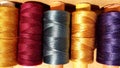 Silk and cotton threads for sewing and embroidery. Spools with multi-colored threads. Royalty Free Stock Photo