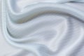 Silk fabric, satin with elastane, blue-gray strip on white Royalty Free Stock Photo