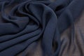 Silk fabric with viscose. Color is dark gray. Texture, background, pattern. Royalty Free Stock Photo