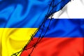 Silk flags of Russian Federation and Ukraine divided by barb wire illustration