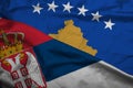 Silk Flags of Serbia and Kosovo. Political crisis .Concept of bad relations between Serbian and Kosovo