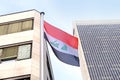 Silk national flag of Algeria on facade building of Consulate General of iraq in Frankfurt, concept of emigration, international