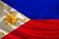 silk national flag of the modern state of the philippines with beautiful folds flutters in the wind, concept of tourism, travel, Royalty Free Stock Photo