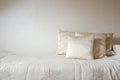 silk pillow and blanket against cream colored wall in bedroom modern and luxurious style, modern decoration,design,architecture Royalty Free Stock Photo