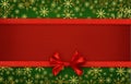 Silk ribbon and a bow on red and green paper Royalty Free Stock Photo