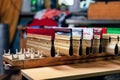 silk screen serigraphy production. squeegees on wooden shelve of the print screening apparatus ready for printmaking. printing