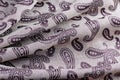 Silk textile with a swirl and ethnic pattern and a beautiful curl