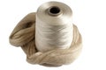 Silk yarn bobbin and raw silk skein Royalty Free Stock Photo