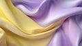 Silky fabric background in pastel yellow and purple colors