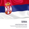 Silky flag of Serbia waving on an isolated white background with the white text area for your advert mess. Royalty Free Stock Photo