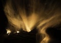 Silky flames and curling embers rising from firelogs burning Royalty Free Stock Photo
