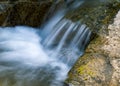 Silky flow of river water shot on low shutter speed Royalty Free Stock Photo