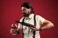 silled waiter. stylish male barman. drinking wine glass. bearded man in suspenders drink red wine. elegant businessman Royalty Free Stock Photo