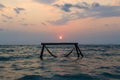 Sillhouette of hammock in sea on sunset Royalty Free Stock Photo