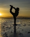Sillouette of acrobat at sunrise on Bolivia Salt Flats