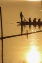 Sillouette of mans padding on lake