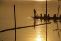 Sillouette of mans padding on lake