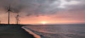 Sillouette of Wind turbine array at seashore Royalty Free Stock Photo