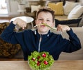 Silly boy who likes vegetable Royalty Free Stock Photo