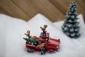 Silly Christmas reindeer around a red pickup truck. Royalty Free Stock Photo