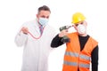 Silly doctor and constructor playing with their tools Royalty Free Stock Photo