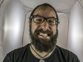 A silly looking bearded man with glasses