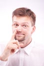 Silly man picking his nose Royalty Free Stock Photo
